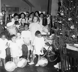 Patients and staff at a Christmas party.