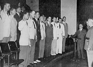 Fourteen graduates of the Class of 1941 take the oath of office as first lieutenants in the Medical Corps Reserve of the United States Army