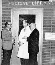 Drs. Wilhelm Moll, Albert J Paquin, Jr., and James E Kindred in front of the old Medical Library