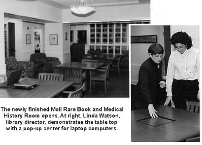 The newly finished Moll Rare Book and Medical History Room opens. At right, Library Director Linda Watson demonstrates a table top's pop-up ethernet port for laptop computers
